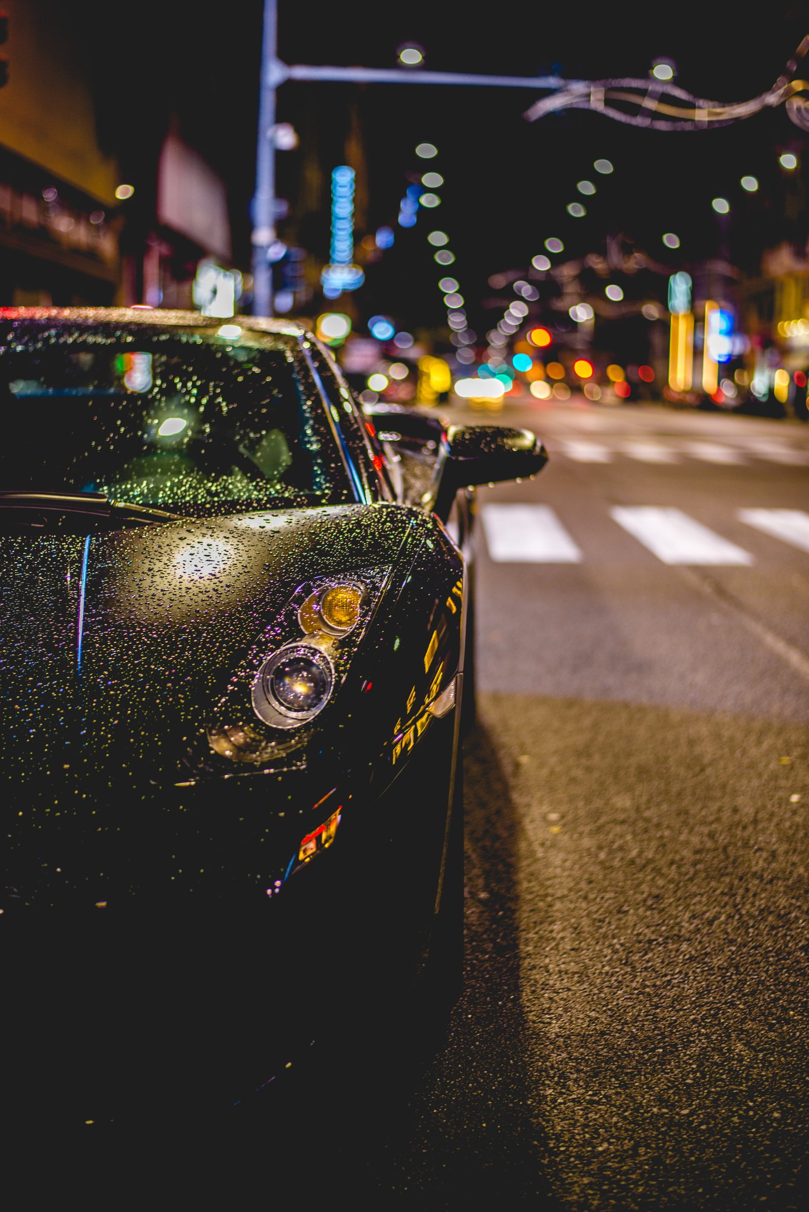 close photography of black convertible on road Lamborghini with water drops during night time 2k 4k 5k