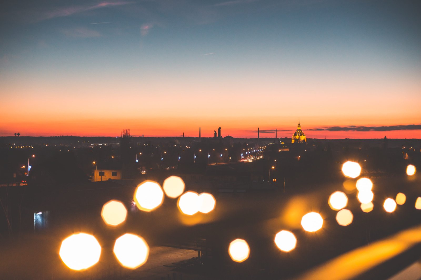 Sunset Cityscape with Bokeh Lights city lights cityscapes cloudless 2k 4k