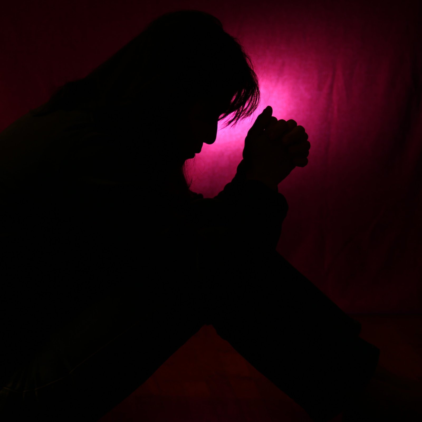 Person s Silhouette on red textile sorrow forgiveness sad 2k 4k