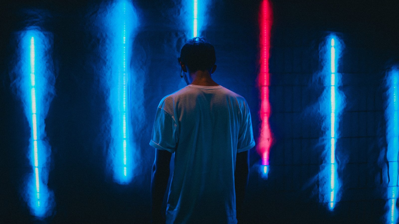 man standing near blue LED strips night light male wall neon 2k 4k 5k
