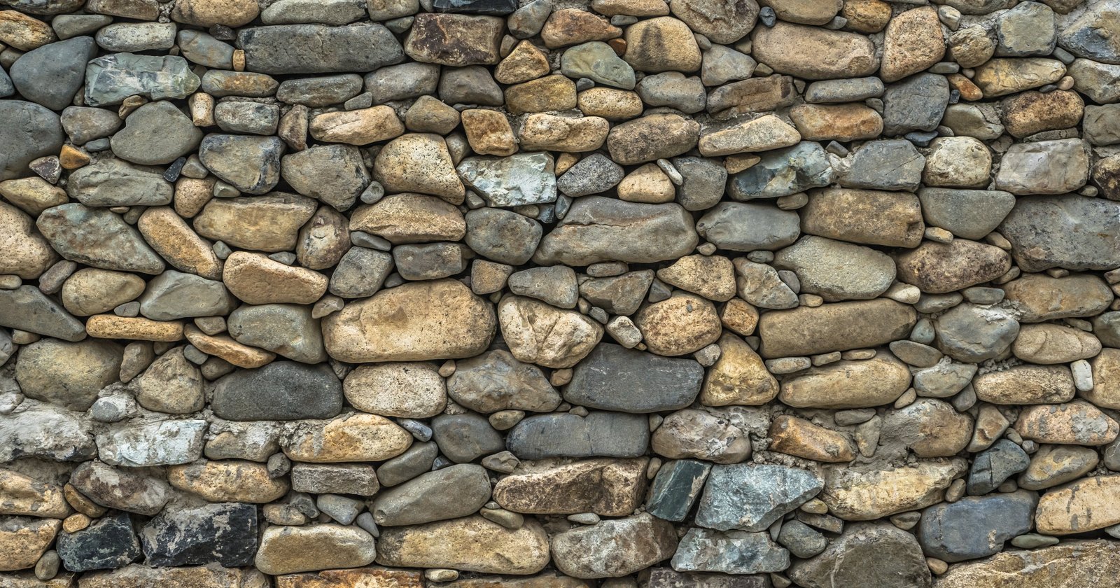 photo of brown and black stone wall damme texture pattern 2k 4k 5k