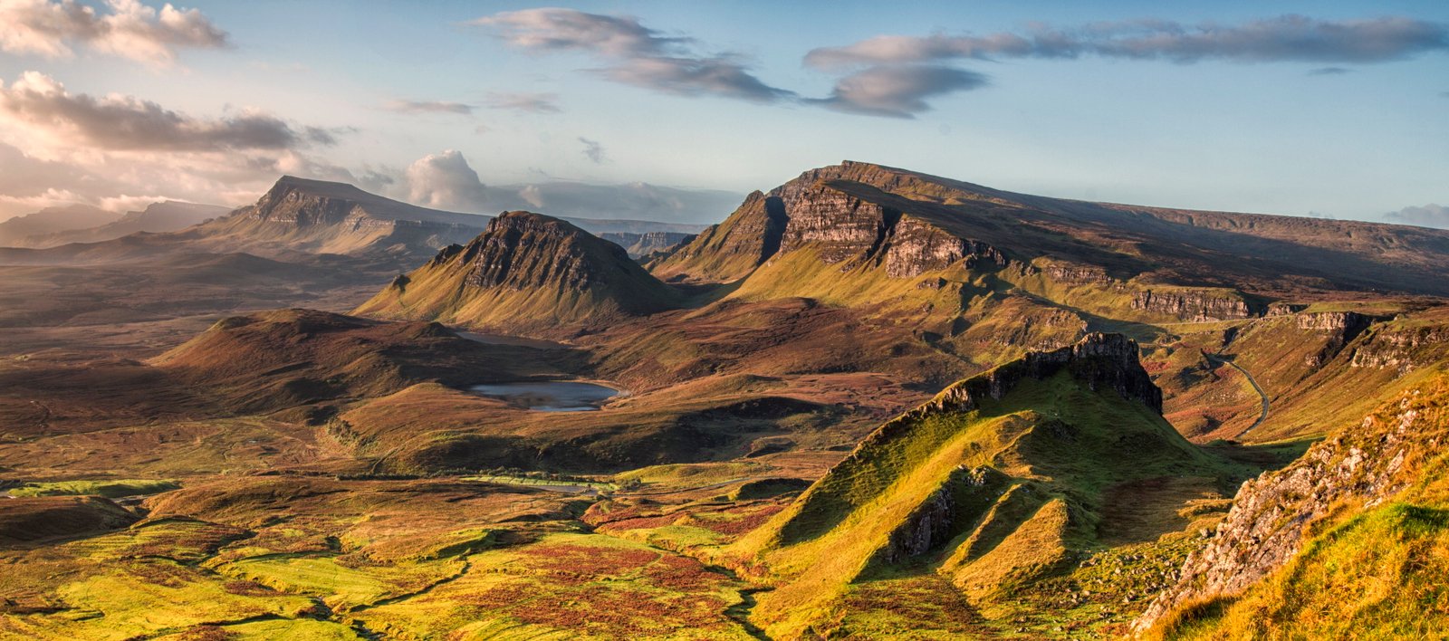 landscape photo of rocky mountains under cloudy sky quiraing skye scotland 2k 4k 5k