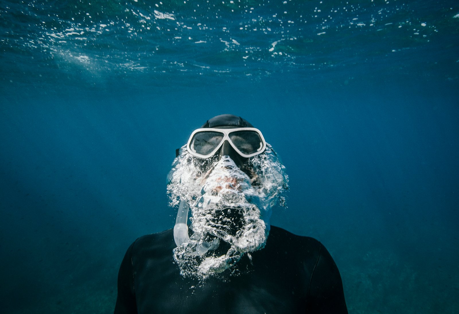 person with snorkle and goggles swimming underwater photo of wearing snorkeling mask 2k 4k 5k