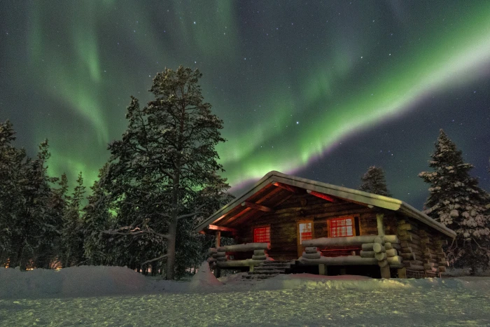 brown wooden cabin house under green northern lights cottage 2k 4k 5k