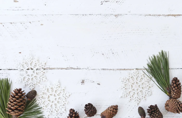 christmas desk flatlay holiday pine cone rustic white wood 2k