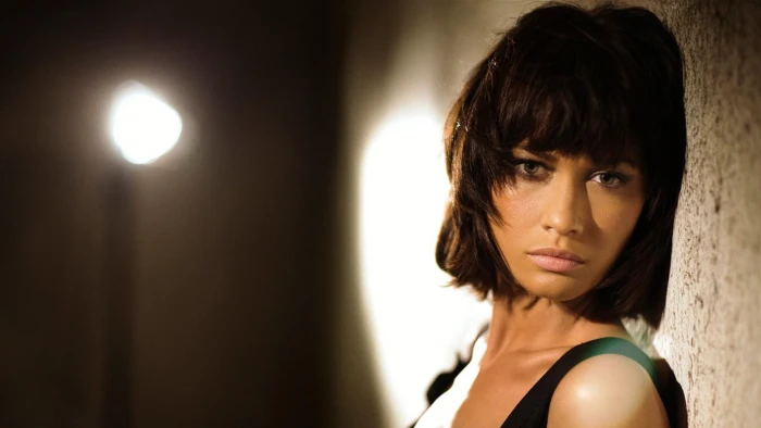 closeup brunette green eyes Olga Kurylenko actress face