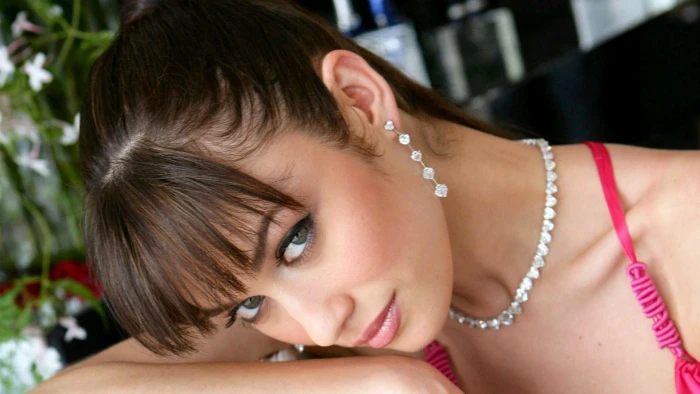 closeup brunette green eyes Olga Kurylenko face long hair