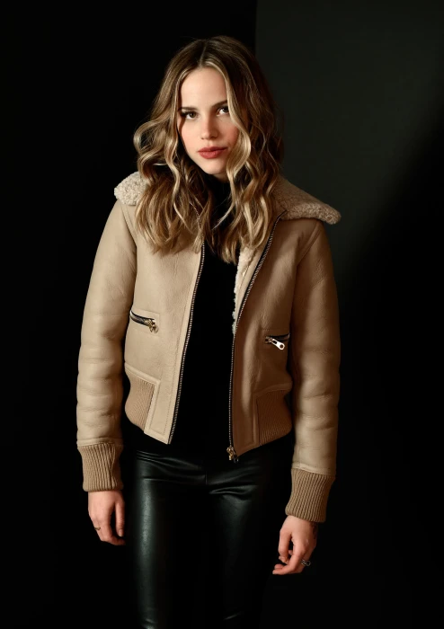 Halston Sage actress women jacket blonde curly hair looking at viewer