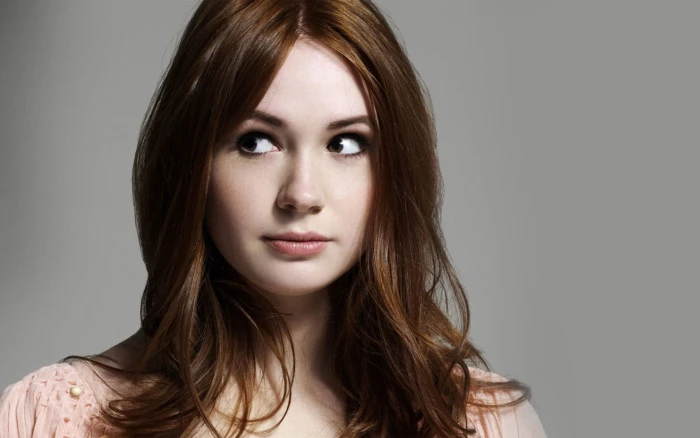 redhead actress closeup Karen Gillan simple background