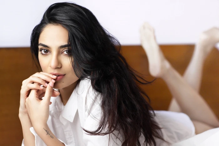 woman in white collared shirt laying on bed Sobhita Dhulipala 2k