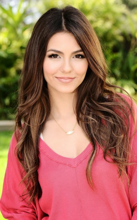 woman wearing silver colored pendant necklace and pink v neck sweatshirt 2k