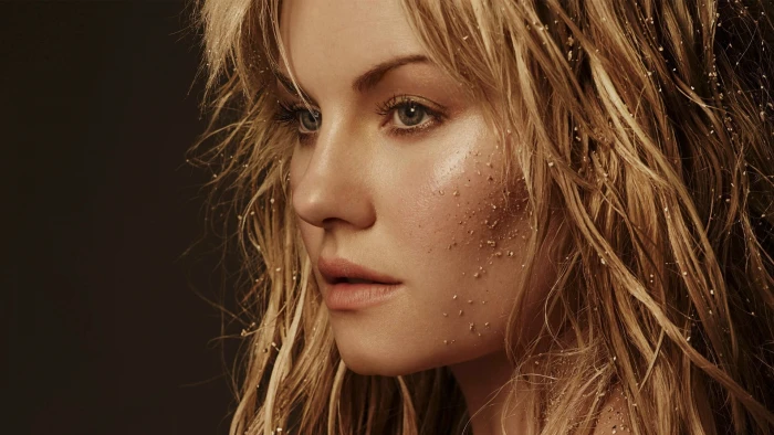 woman's face Elisha Cuthbert blonde green eyes gold actress