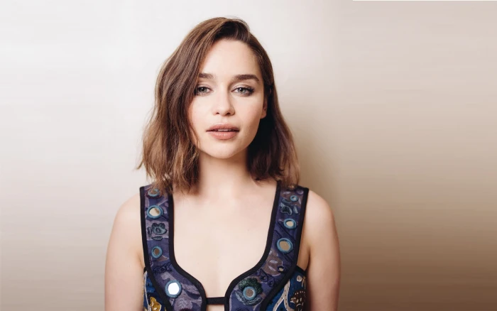 women's blue and purple top Emilia Clarke brunette actress