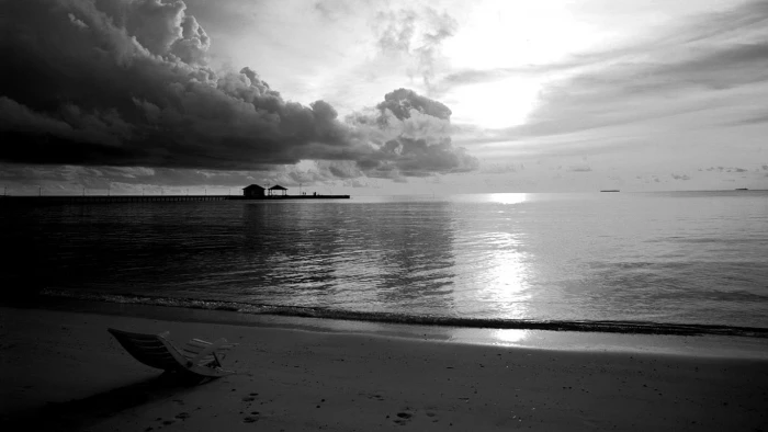 grayscale photo of beach monochrome sea clouds sky horizon