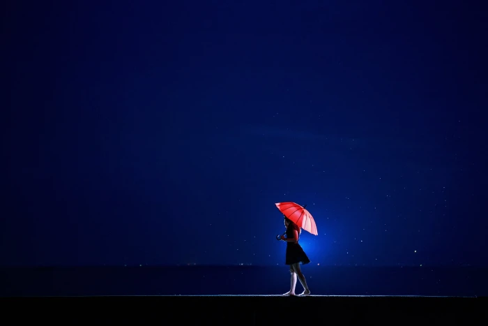 woman in black dress holding red umbrella nature landscape 2k