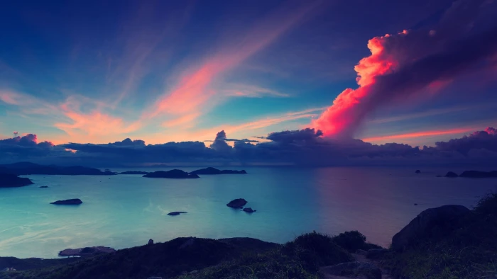 body of water and cumulus clouds calm under orange blue sky 2k
