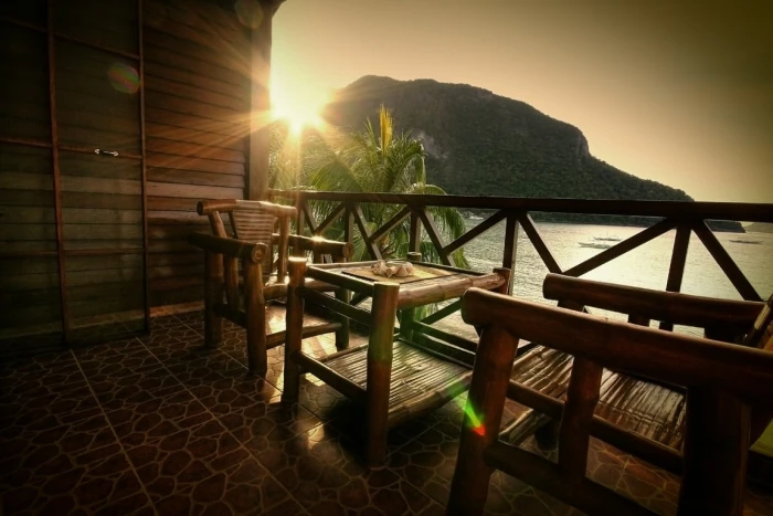 rectangular brown wooden table with four chairs dining set beach