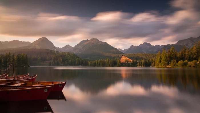 body of water lake nature boat mountains sky reflection 2k