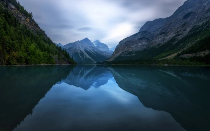 body of water between mountain during daytime nature landscape 2k
