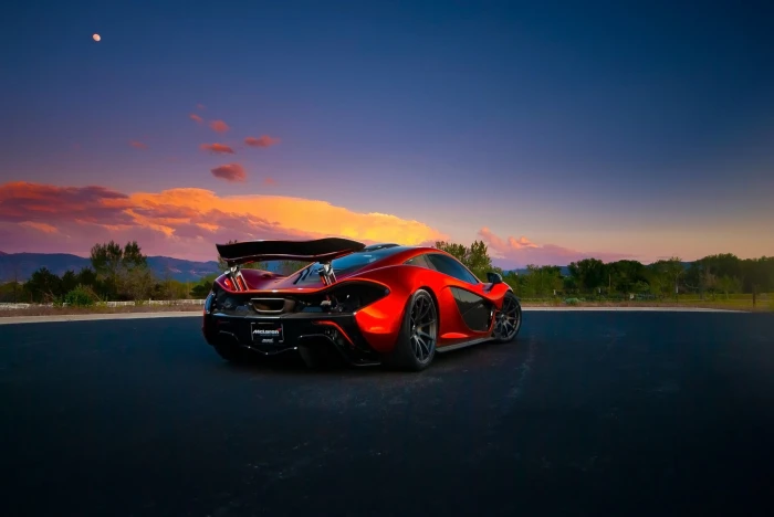 red and black sports car McLaren mode of transportation 2k