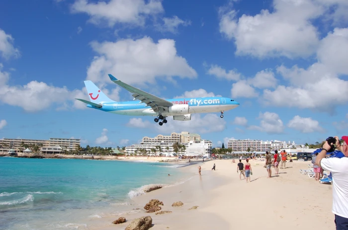 blue and white airplane beach photo the plane Maho Beach 2k