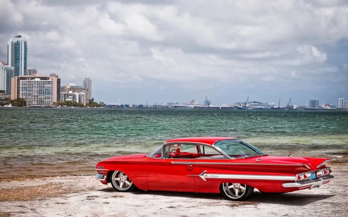 car Chevrolet Impala sea beach sky cloud building exterior 2k