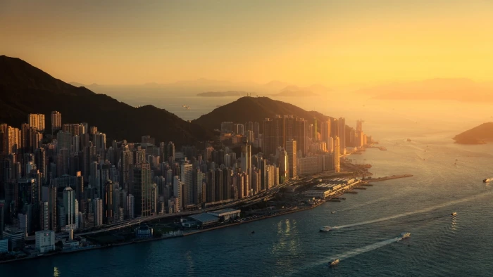 white high rise buildings aerial view photography of city near mountain 2k