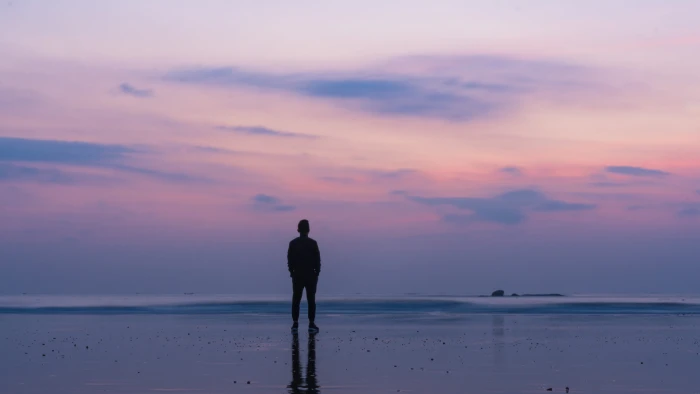 silhouette of man standing on seashore china beach xiamen 2k 4k 5k