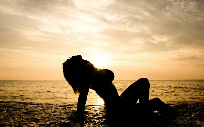 silhouette of woman sea beach girl sunset Susan Wayland 2k