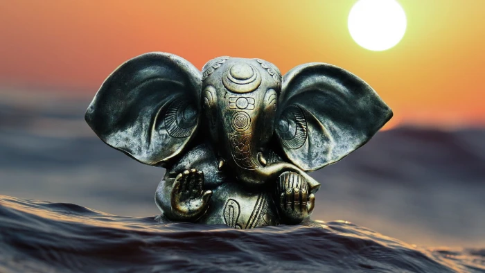 ganesha hindu god goddess sun water statue close up 2k