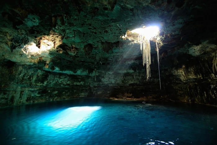 blue lagoon inside a cave nature landscape cenotes Mexico 2k