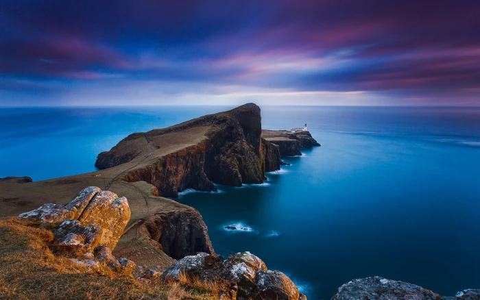 brown cliff nature landscape lighthouse sunset sea clouds 2k