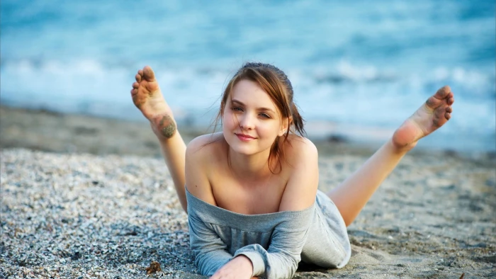 brunette Amelie women on beach smiling outdoors 2k