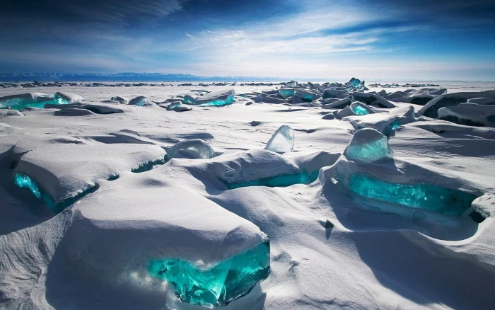 green stones ice field during daytime Russia Siberia snow 2k