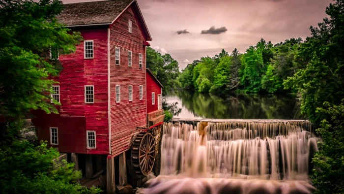 red concrete house near in waterfalls nature landscape architecture 2k