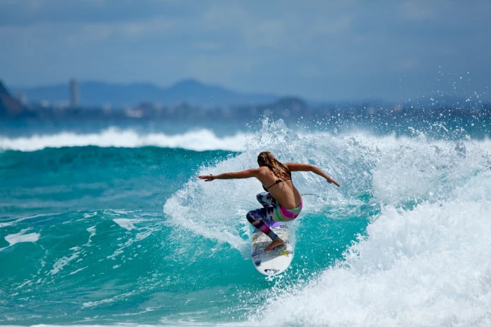 sports women on beach surfers back brunette 2k
