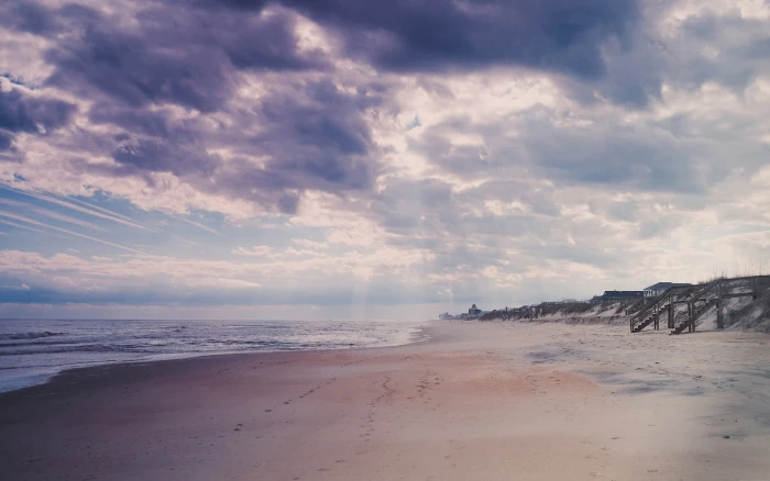 brown beach photography footprints clouds sky sea land 2k