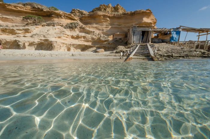 brown wooden house nature landscape beach Formentera balearic islands 2k