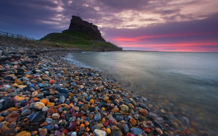 assorted stones castle ancient beach England sea sunset 2k