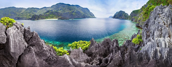 panoramic photography of body water surrounded by mountains 2k