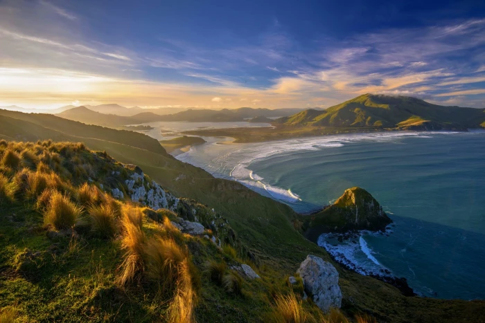 sunset beach grass New Zealand sea mountains clouds nature 2k
