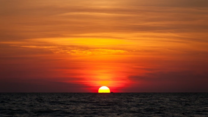 beach sunset horizon sea boat water sky over 2k