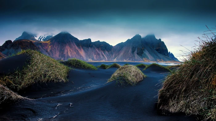 mountains beach black sand dune Iceland cliff grass 2k