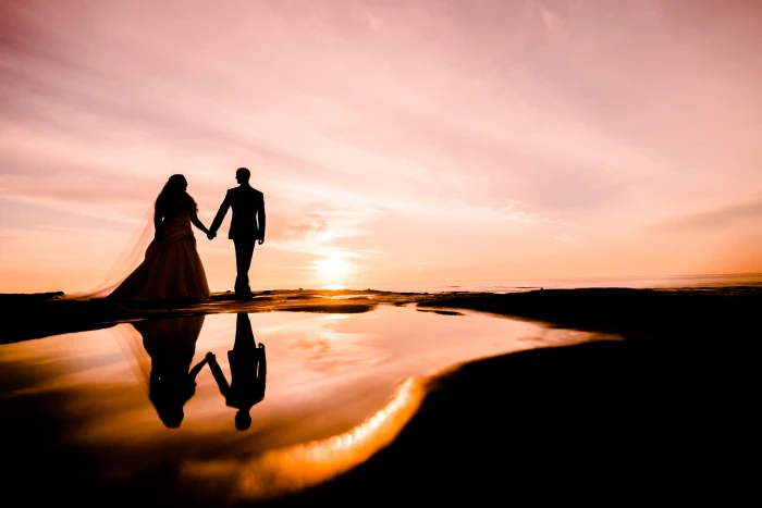 silhouette photography of couple walking near body water wedding 2k 4k 5k