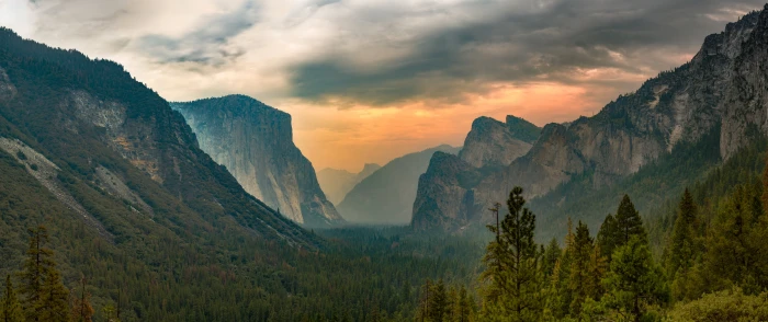 green trees on rocky mountain during daytime Inferno Photography 2k