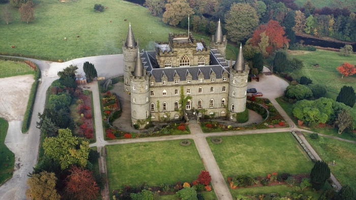 beige castle surrounded by green landscapes architecture 2k
