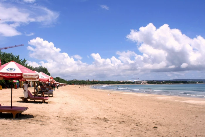 photography of seashore with kiosks under alto cumulus clouds and blue calm sky 2k