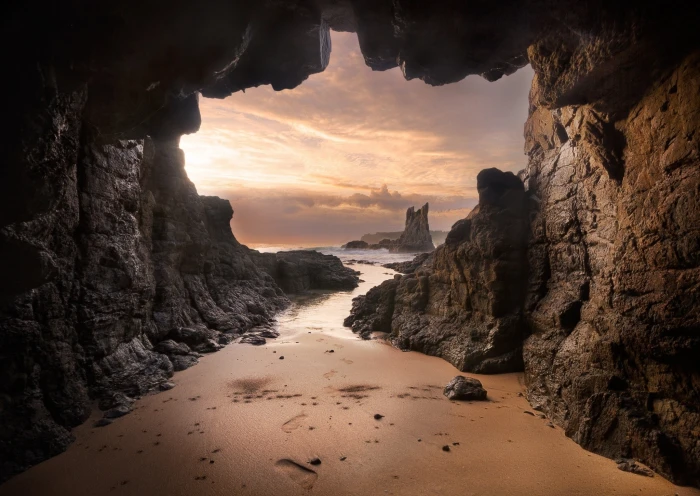 beach cave Australia sand rock sea sunset clouds nature 2k