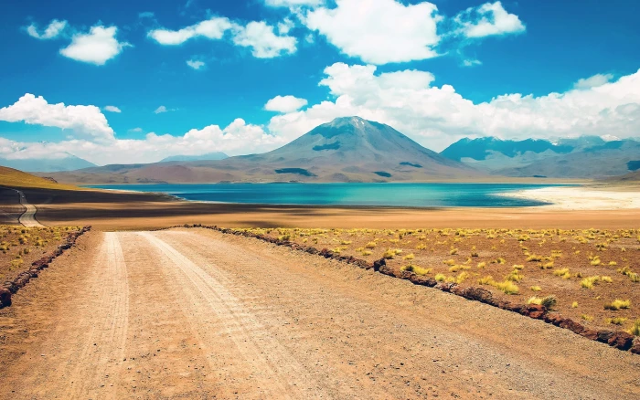 mountain near body of water landscape desert nature road 2k