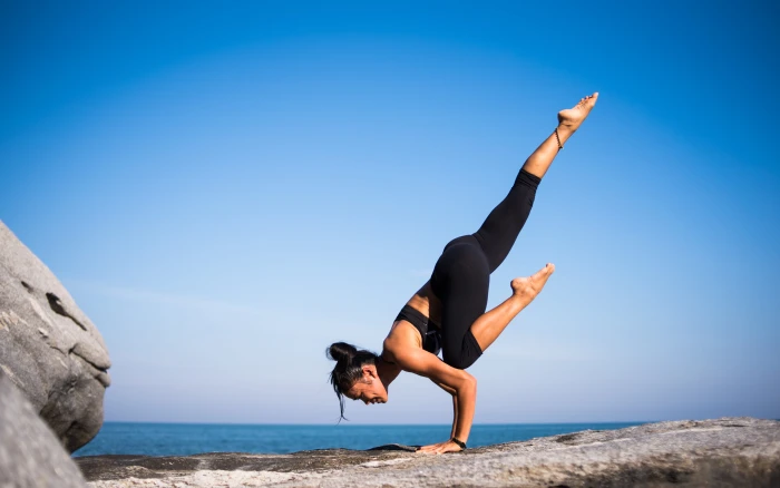 Low Angle View of Woman Relaxing on Beach Against Blue Sky balance 2k 4k 5k